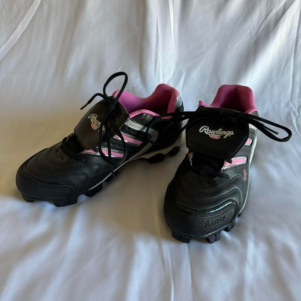 black and pink Rawlings sneakers cleats